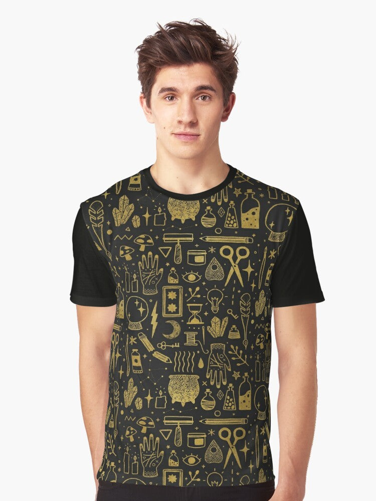 A gold and black graphic t-shirt featuring the words "Make Magic" with occult and witchy elements like a cauldron, mushrooms, and tarot cards. - Men