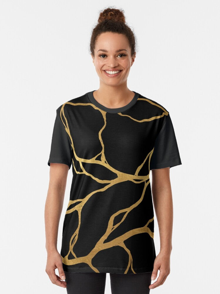 Kintsugi graphic t-shirt featuring a Japanese-inspired pattern with gold cracks and broken porcelain design - Women