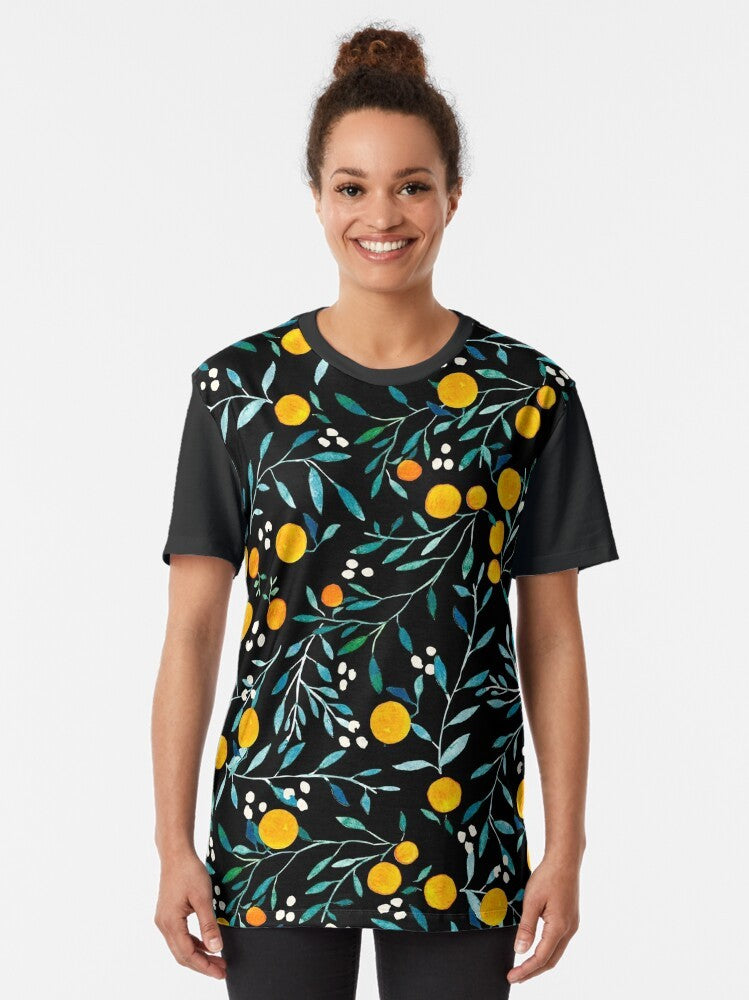 Watercolor floral pattern with vibrant oranges on a black graphic t-shirt - Women