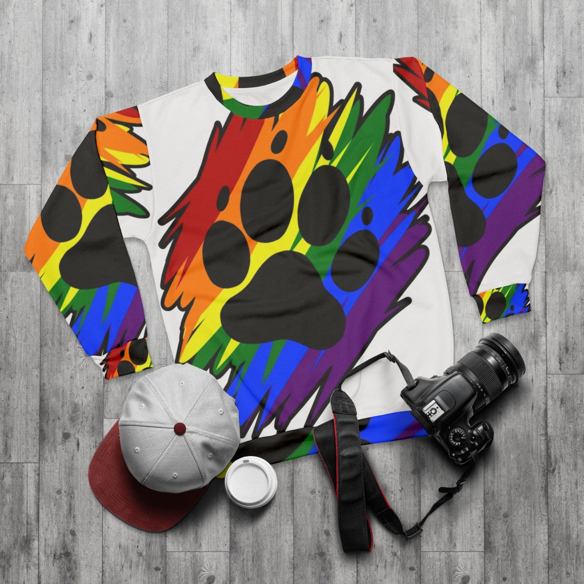 Vibrant rainbow paint splatter design on a comfortable sweatshirt - flat lay