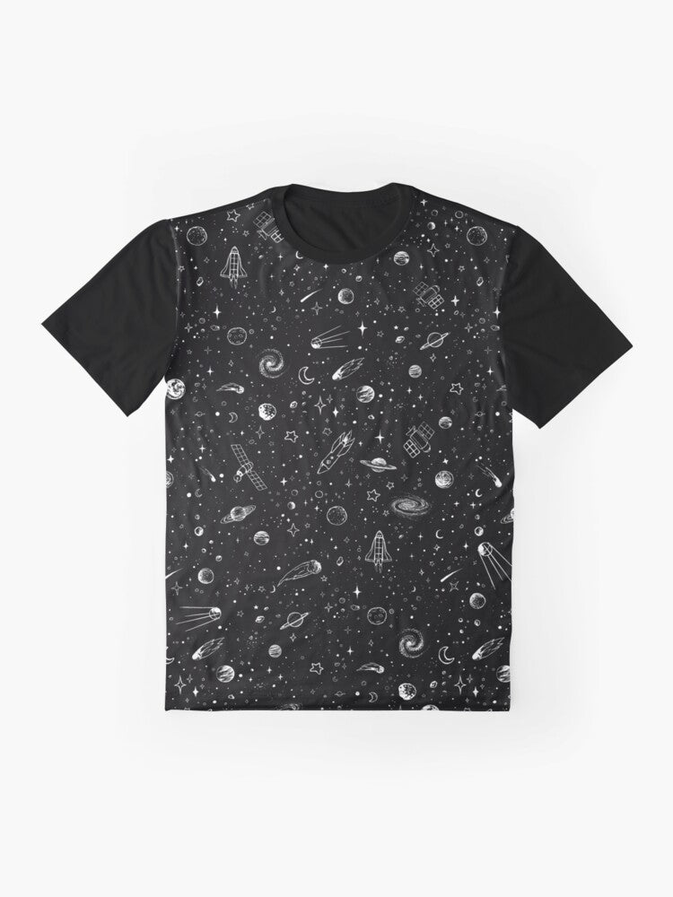 A black and white graphic t-shirt design featuring a cosmic space theme with planets, stars, and a rocket. - Flat lay