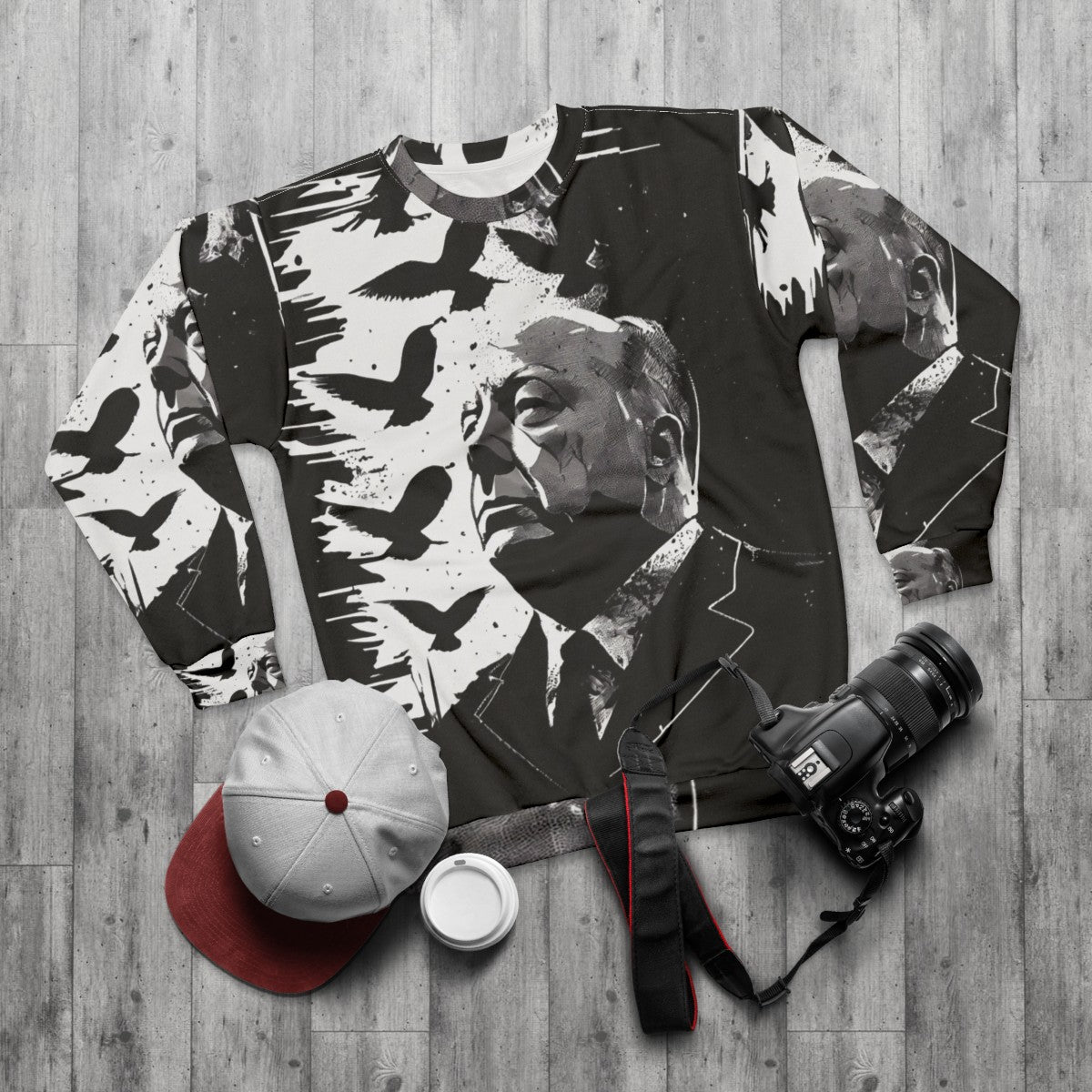 Alfred Hitchcock portrait sweatshirt with "The Birds" film reference - flat lay