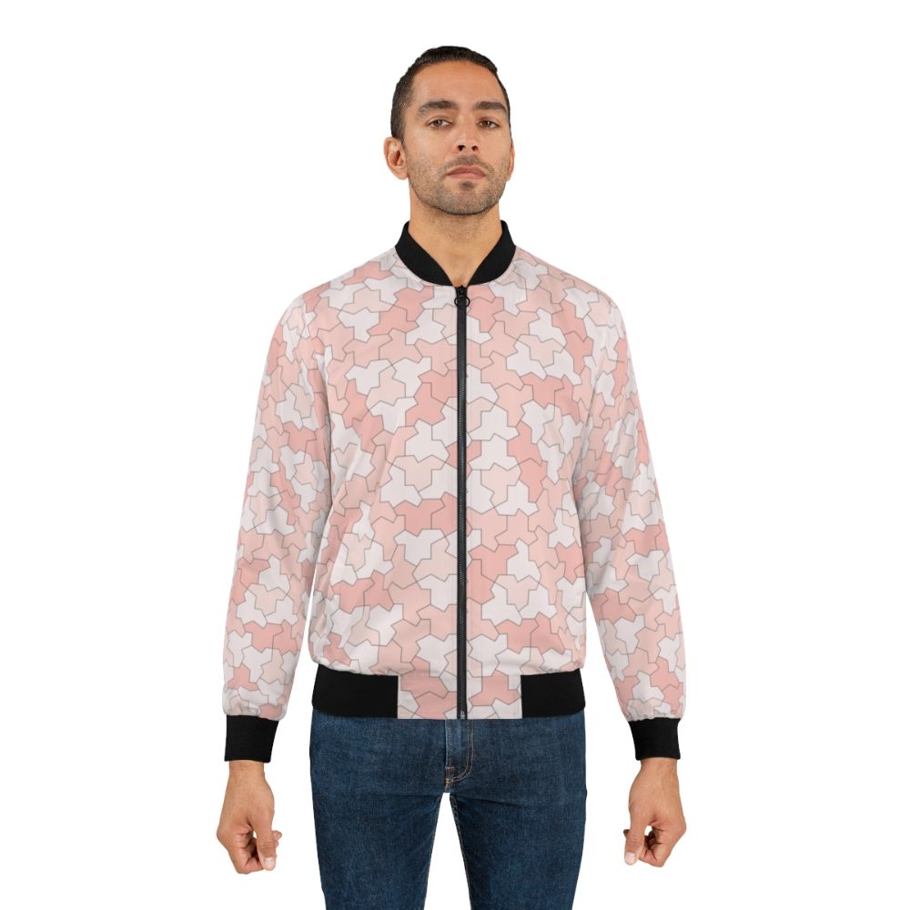 Geometric bomber jacket featuring aperiodic monotile Einstein shapes in peach and pink tones - Lifestyle