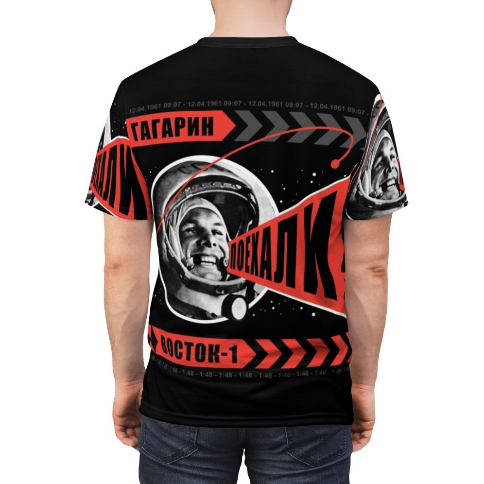 Retro-style t-shirt featuring the iconic "Poyekhali" space art design by Alexander Rodchenko, celebrating the Soviet space program and Yuri Gagarin's historic flight. - men back