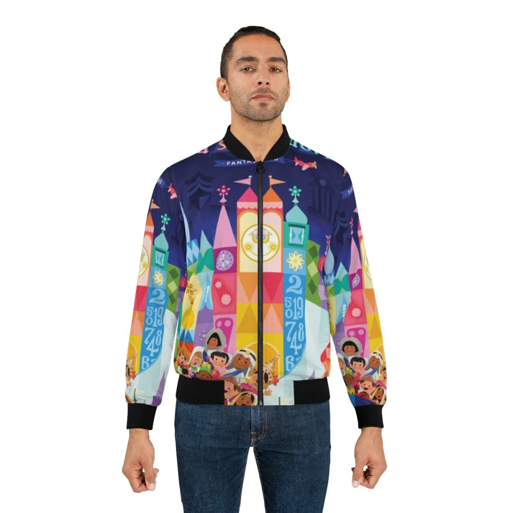 Colorful bomber jacket featuring a whimsical small world fantasyland design with children, boats, and a magical, dreamlike landscape. - Lifestyle