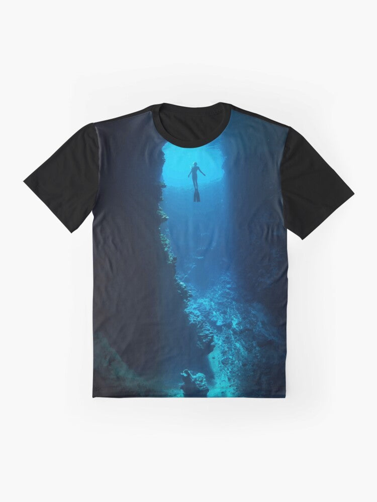 A graphic t-shirt featuring a free diver exploring the ocean - Flat lay