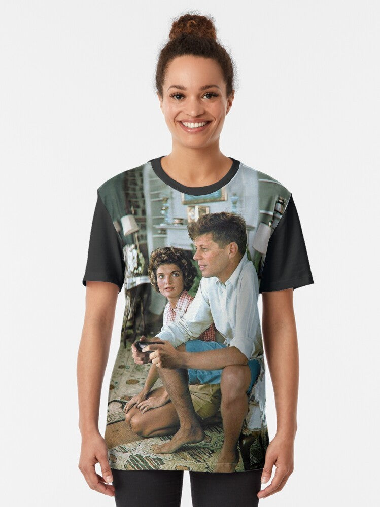 "Graphic tee featuring JFK playing on a PS4 controller with 'Press F' text" - Women