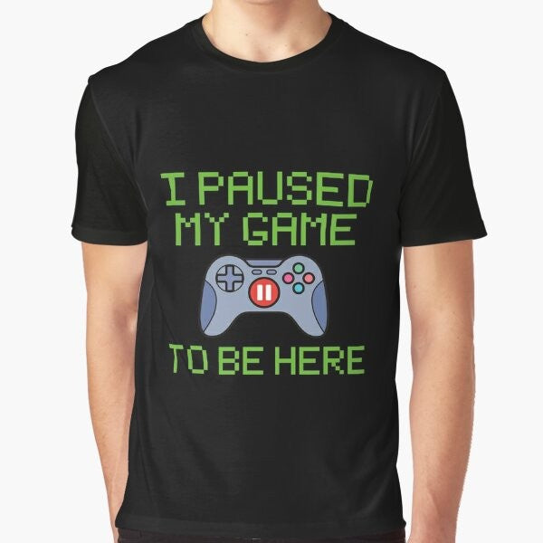 Funny graphic t-shirt for gamers featuring the text "I Paused My Game to Be Here"