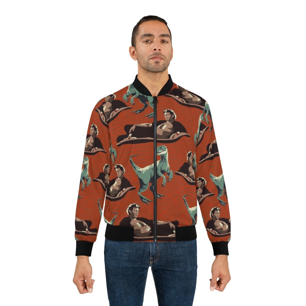 A bomber jacket featuring a graphic design of a velociraptor from the Jurassic Park franchise, including the likeness of actor Jeff Goldblum. - Lifestyle