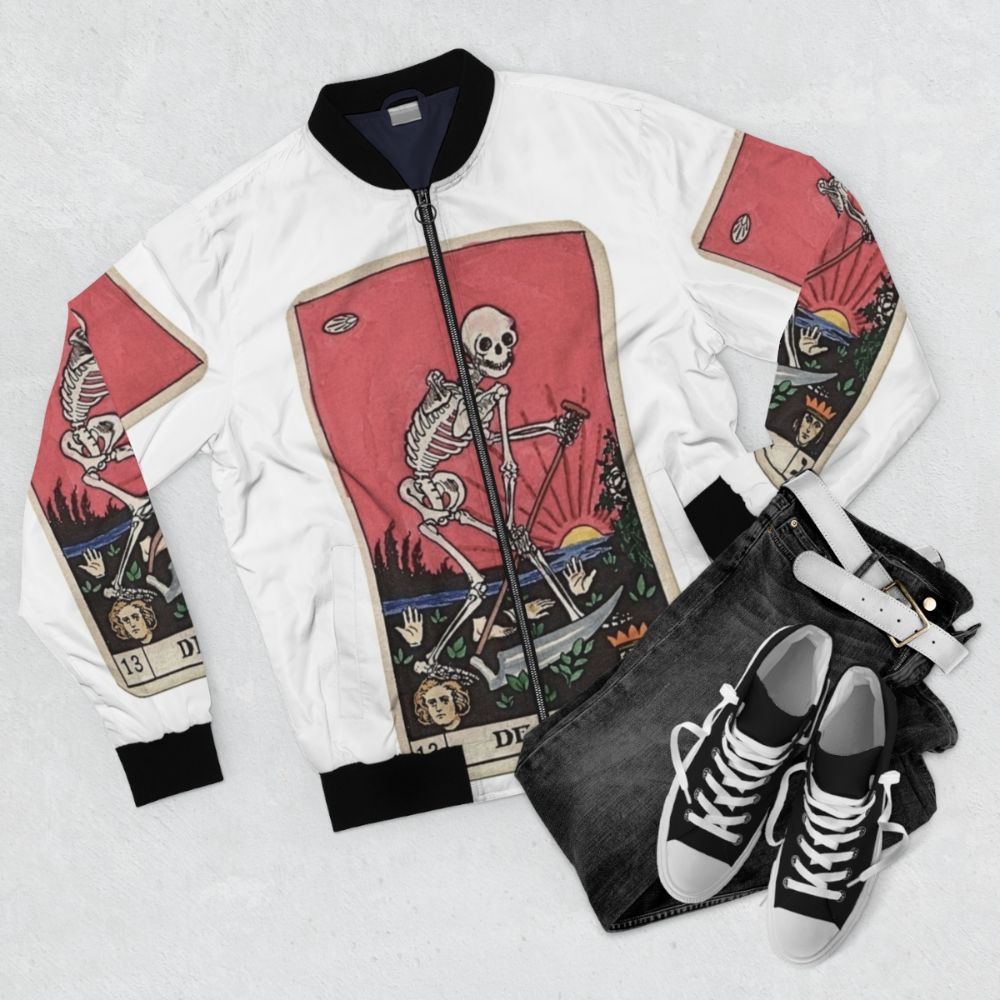 A vintage-inspired bomber jacket featuring the Death tarot card design, perfect for a spooky, occult, or supernatural aesthetic. - Flat lay