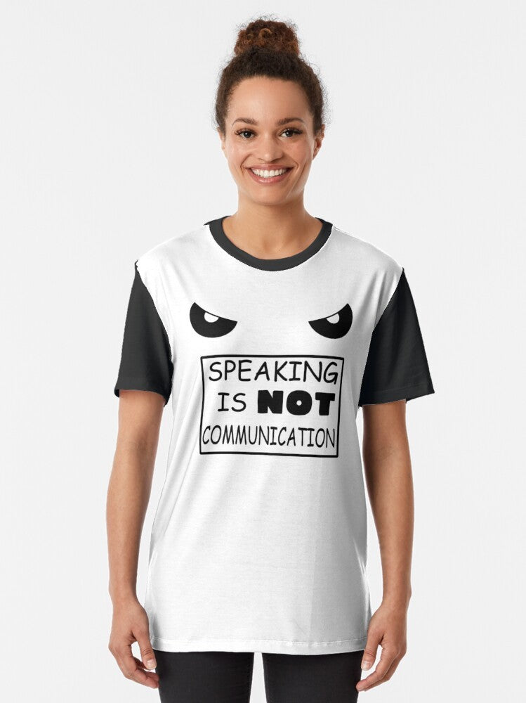 A minimalist graphic t-shirt with the text "Speaking is NOT communication" in a typographic design. - Women