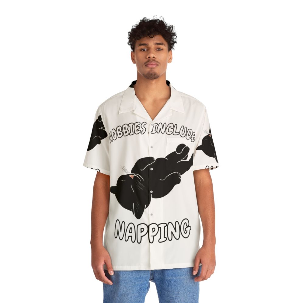 Napping black cat on Hawaiian shirt - People Front