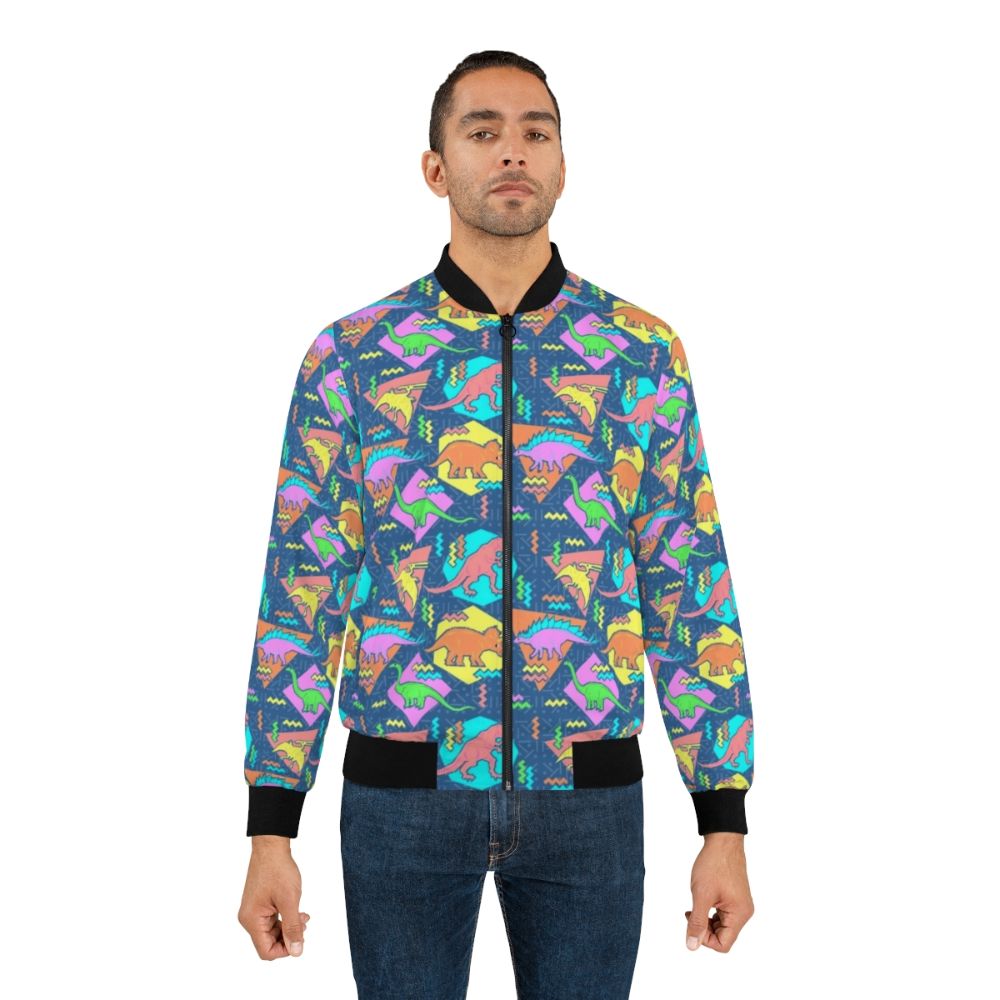 Nineties-inspired bomber jacket with a vibrant dinosaur and geometric pattern design. - Lifestyle