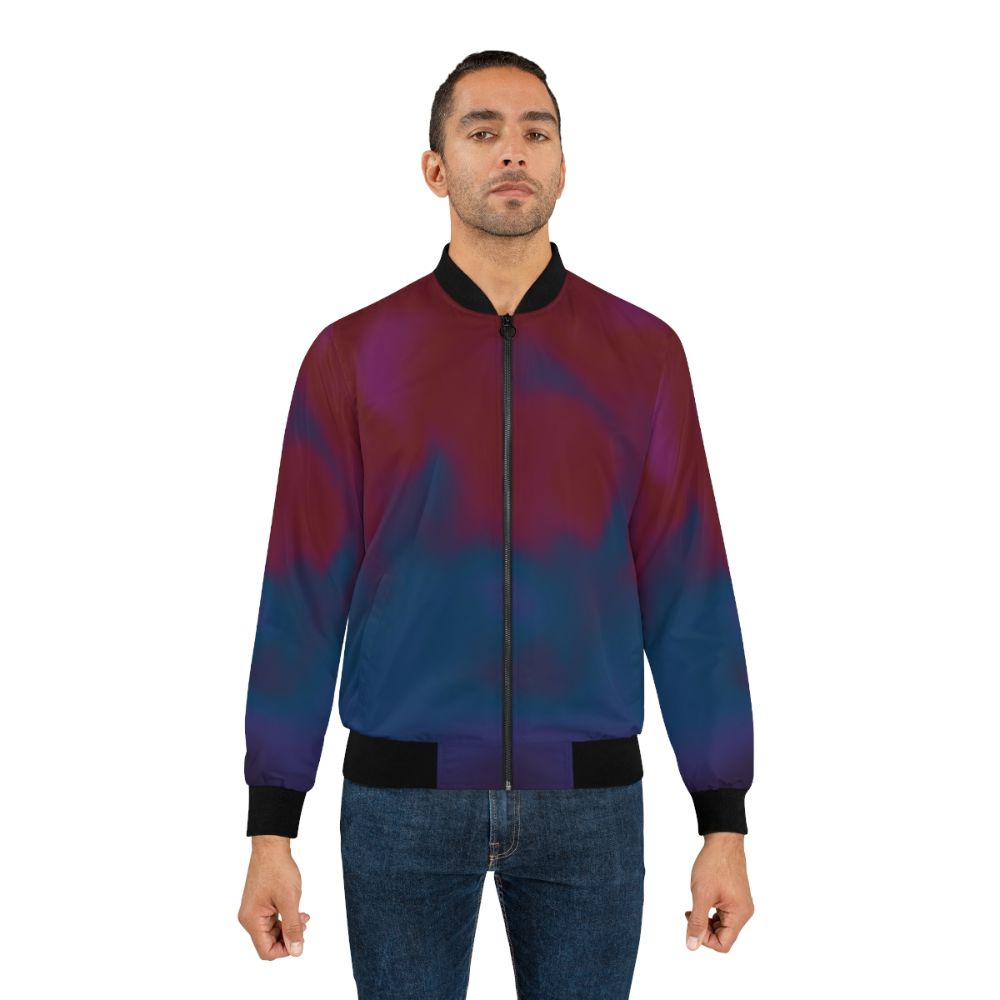 Chris Martin wearing a dark bomber jacket from the MOTS (Music of the Spheres) collection - Lifestyle