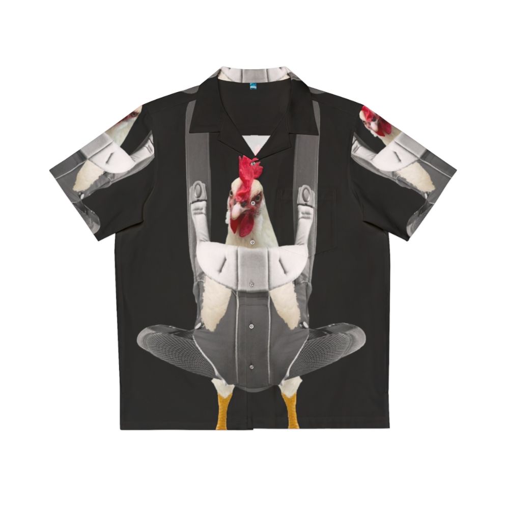 Chicken in baby carrier wearing a Hawaiian shirt