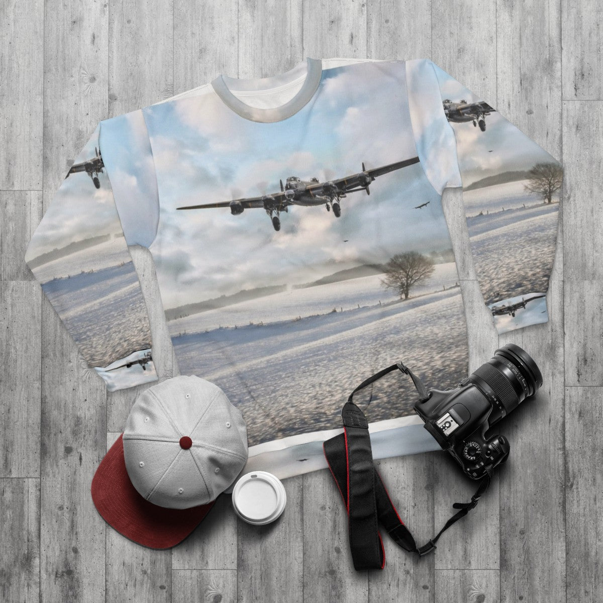 Avro Lancaster bomber in snowy landscape on winter sweatshirt - flat lay