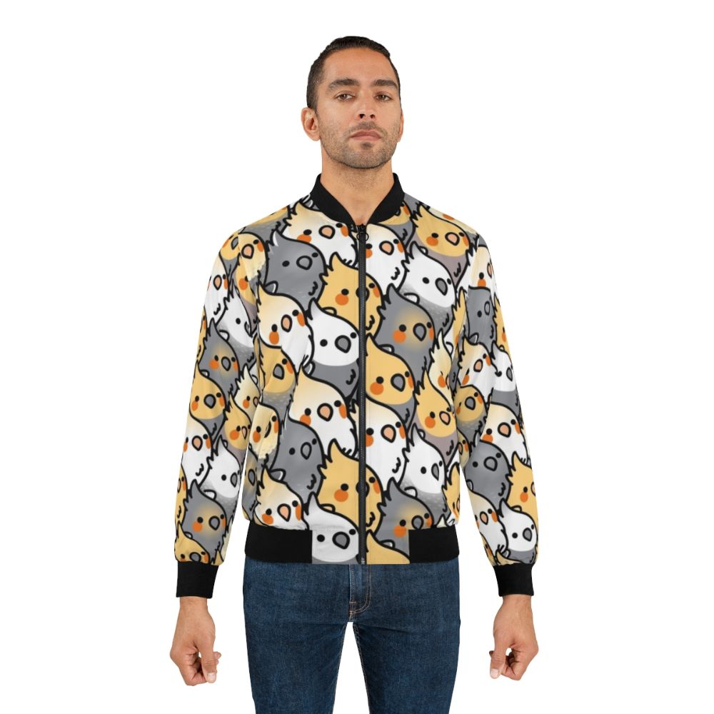 A colorful bomber jacket featuring a repeating pattern of cute cockatiels in shades of white, grey, and orange. - Lifestyle