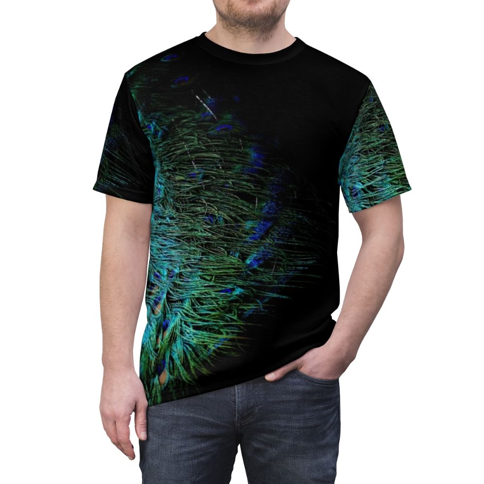 A stylish t-shirt featuring a bold and vibrant peacock feather design against a black background. - men front