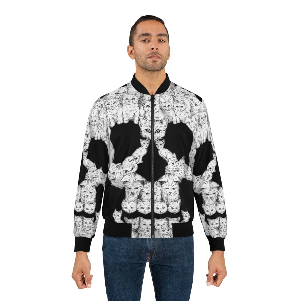 A bold bomber jacket featuring a graphic design of a skull and cute kittens - Lifestyle