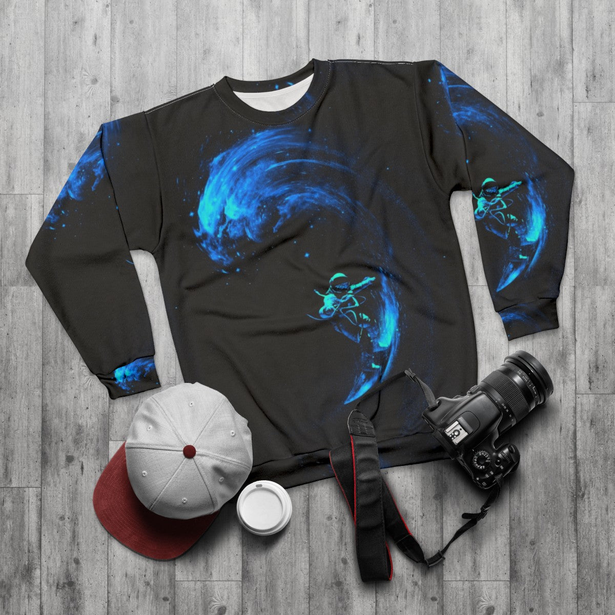 Cosmic Space Surfing Sweatshirt with galaxy, stars and astronaut design - flat lay