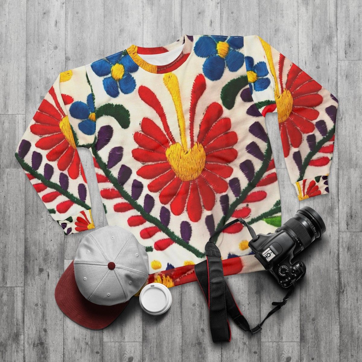 Mexican flowers sweatshirt with red floral design - flat lay