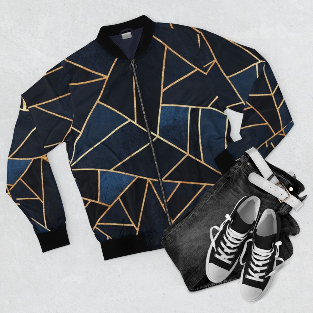 Navy blue bomber jacket with geometric, abstract patterns - Flat lay