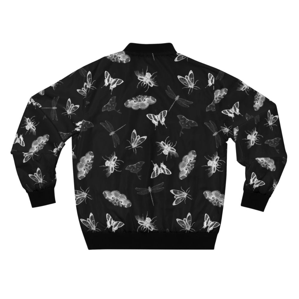 Bomber jacket with a black and white pattern of various bugs, insects, and entomology elements for a creepy, nightmare-inducing design. - Back