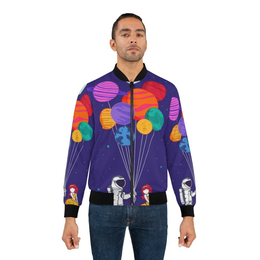 A colorful, space-themed bomber jacket with a romantic, cute design featuring planets, stars, and a couple in love. - Lifestyle