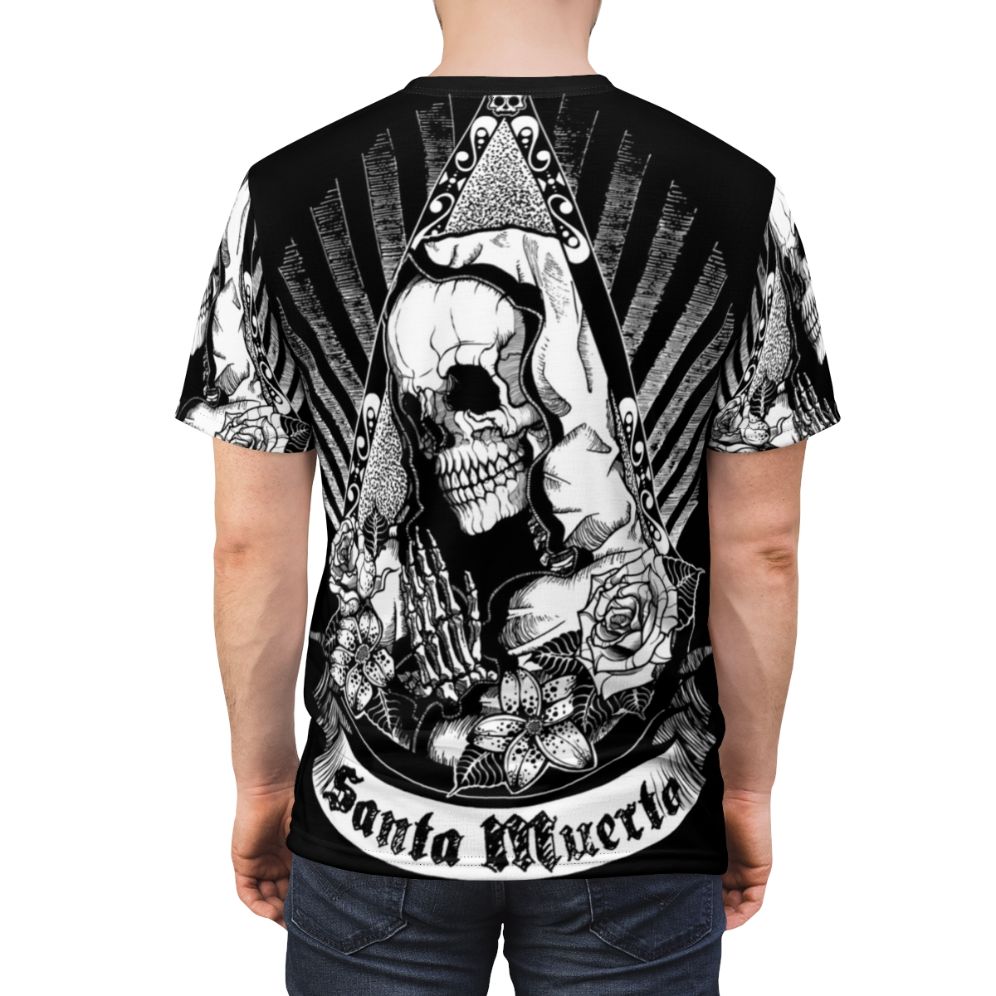 Dark graphic t-shirt with a Santa Muerte design featuring a skull, skeleton flowers, and occult symbols representing Mexican folklore and culture. - men back