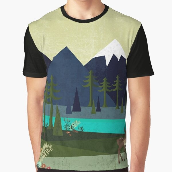 Graphic t-shirt featuring a peaceful landscape with deer, trees, and a river