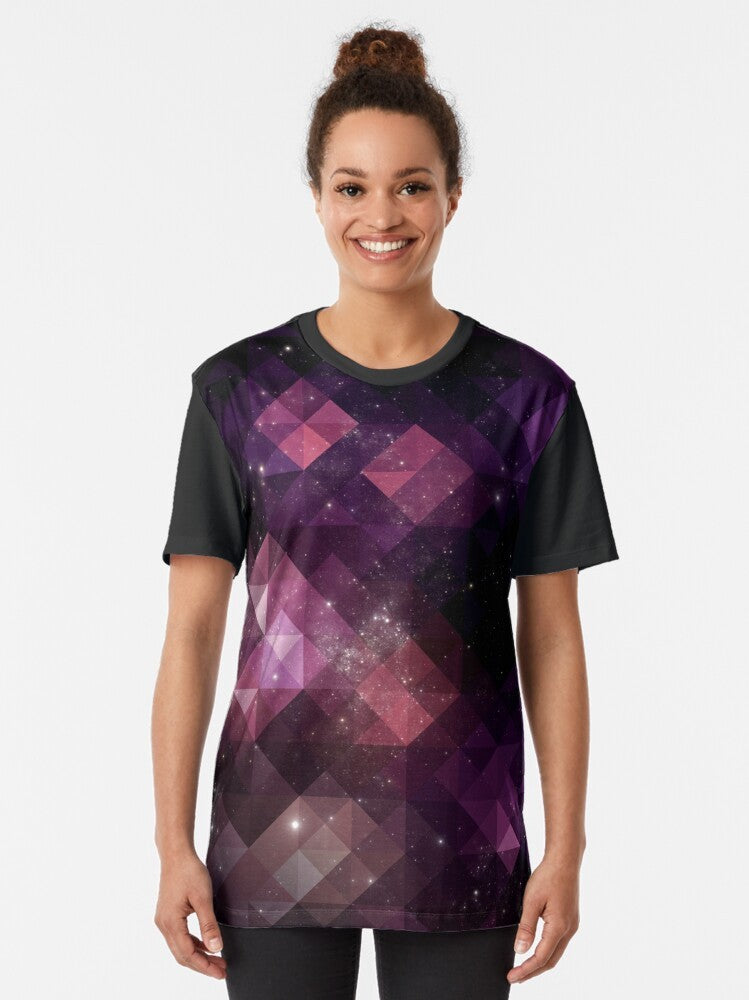 A vibrant graphic t-shirt featuring a space-inspired design with triangles, stars, and cosmic patterns in shades of pink, black, and purple. - Women