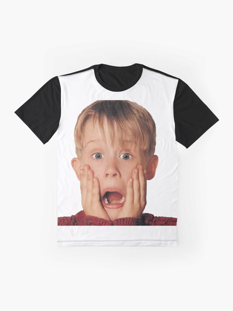 Macaulay Culkin wearing a red shirt in the iconic "Home Alone" movie poster graphic on a t-shirt - Flat lay