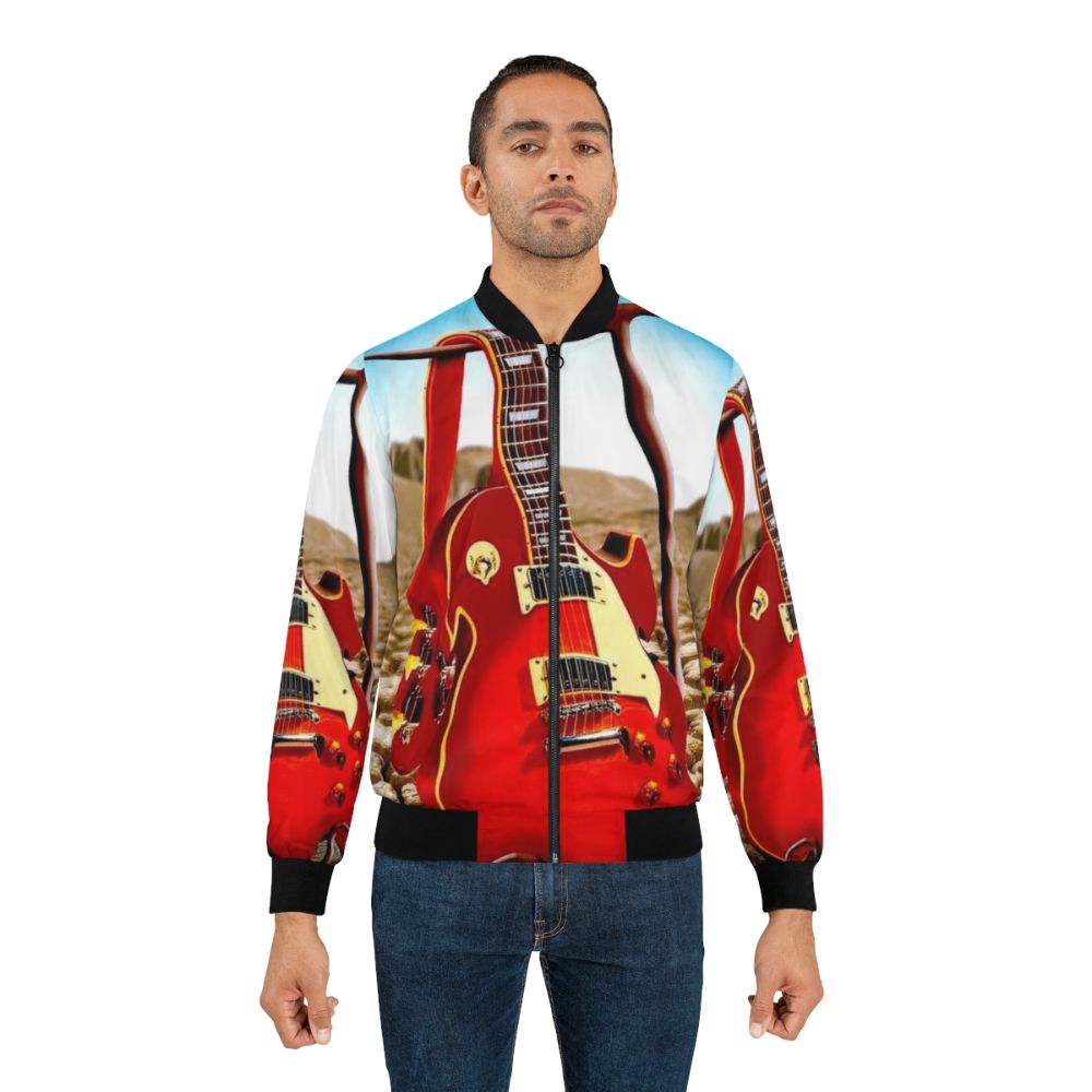 Vintage abstract bomber jacket with a surreal, psychedelic melted guitar and desert design. - Lifestyle