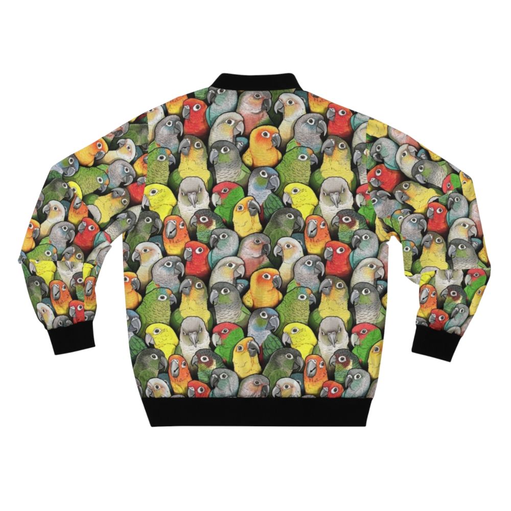 Colorful bomber jacket with a pattern featuring various conure species, including scarlet, crimson, peach faced, pineapple, and yellow sided conures. - Back