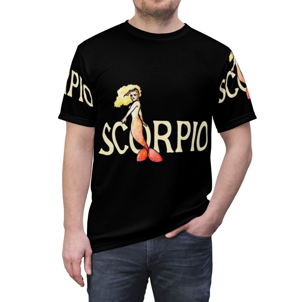 A stylish t-shirt featuring a graphic design of a scorpio mermaid, a mythical sea creature representing the zodiac sign. - men front