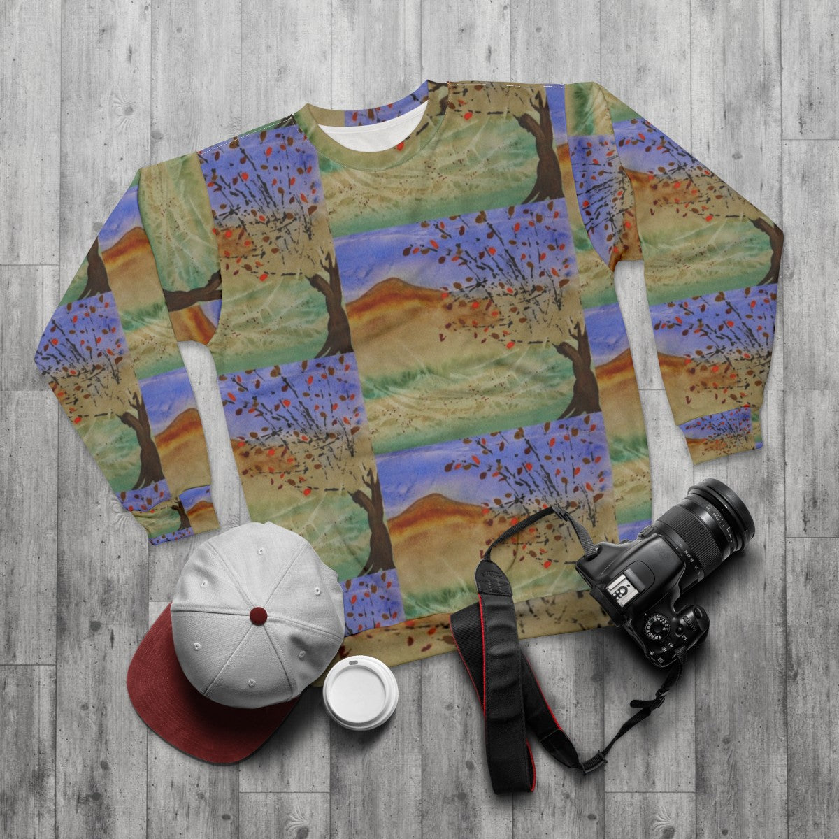 Windswept sweatshirt in natural landscape - flat lay