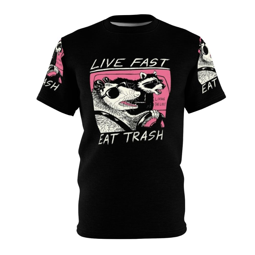 A vibrant all-over print t-shirt design featuring a retro-style graphic with a raccoon, the text "Live Fast Eat Trash", and other vintage-inspired elements.