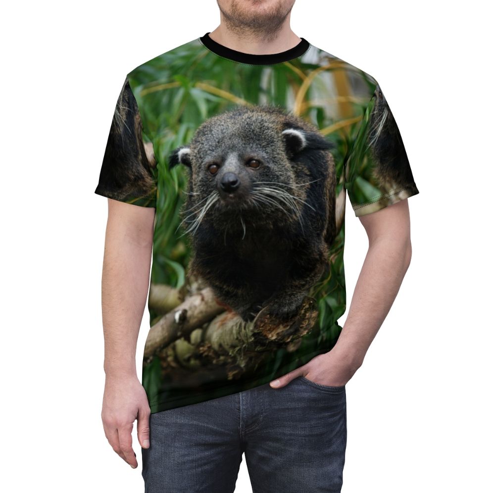 Photograph of a Binturong, also known as a Bearcat, wearing a custom t-shirt with a binturong-themed graphic. - men front