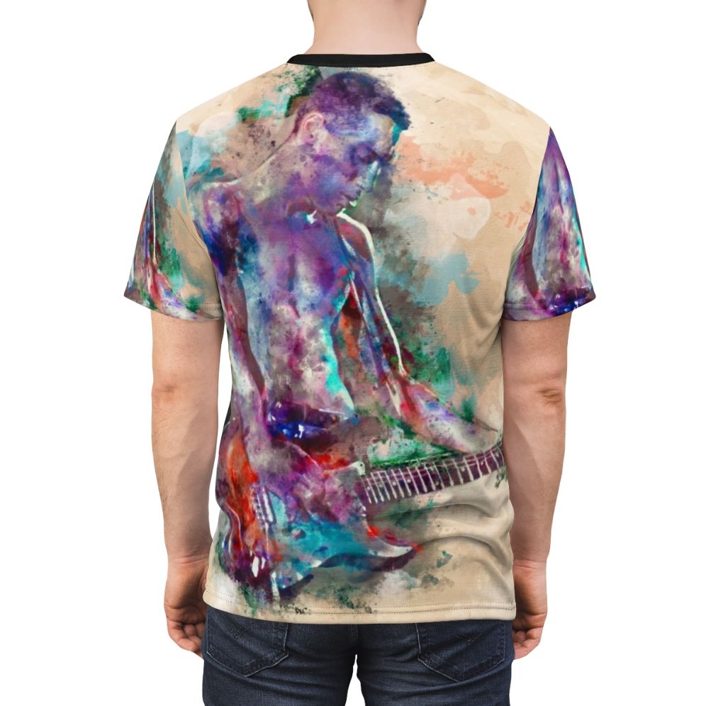 A realistic watercolor graphic of a young male guitar player on a t-shirt - men back