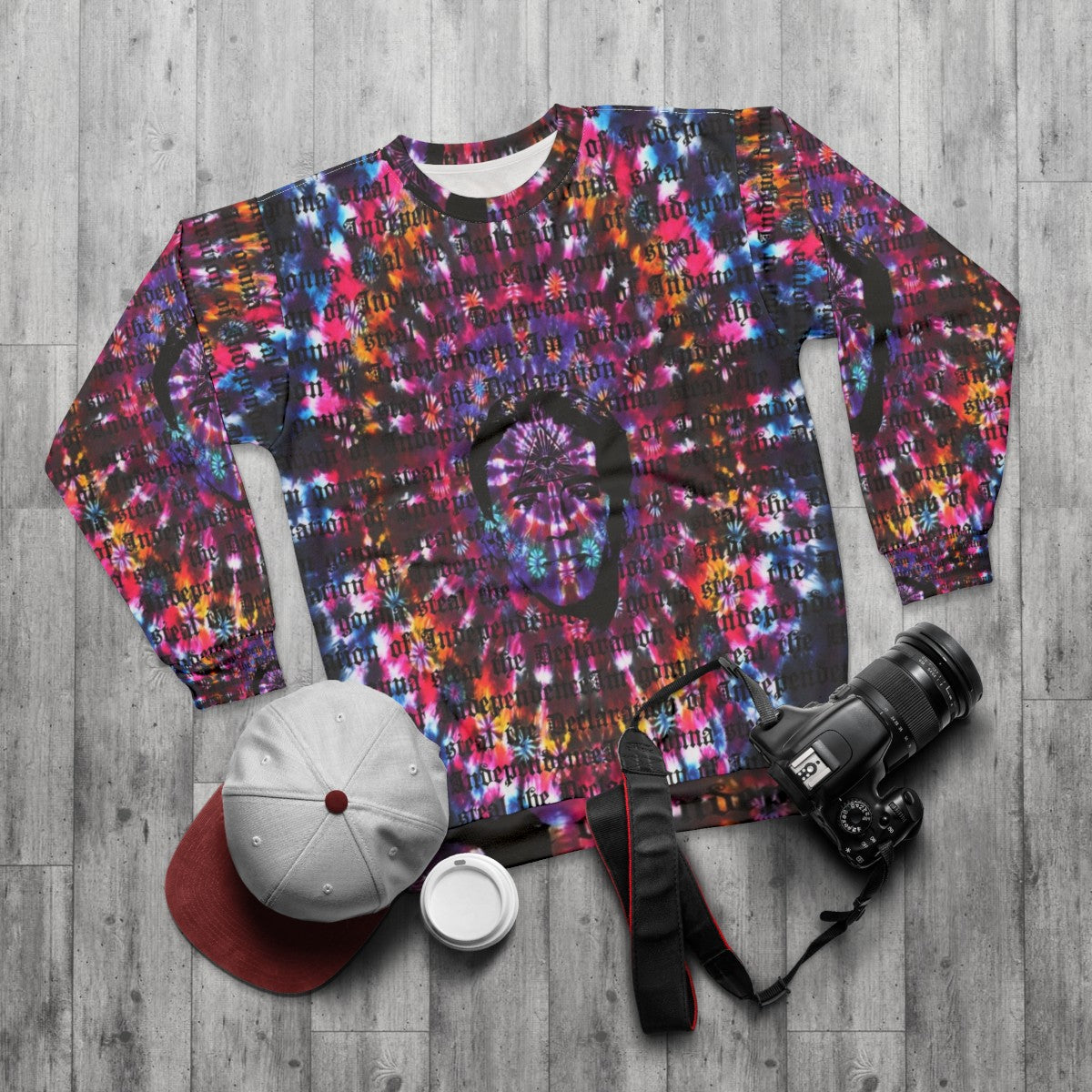 Nicolas Cage tie dye sweatshirt with Shambhala music festival design - flat lay