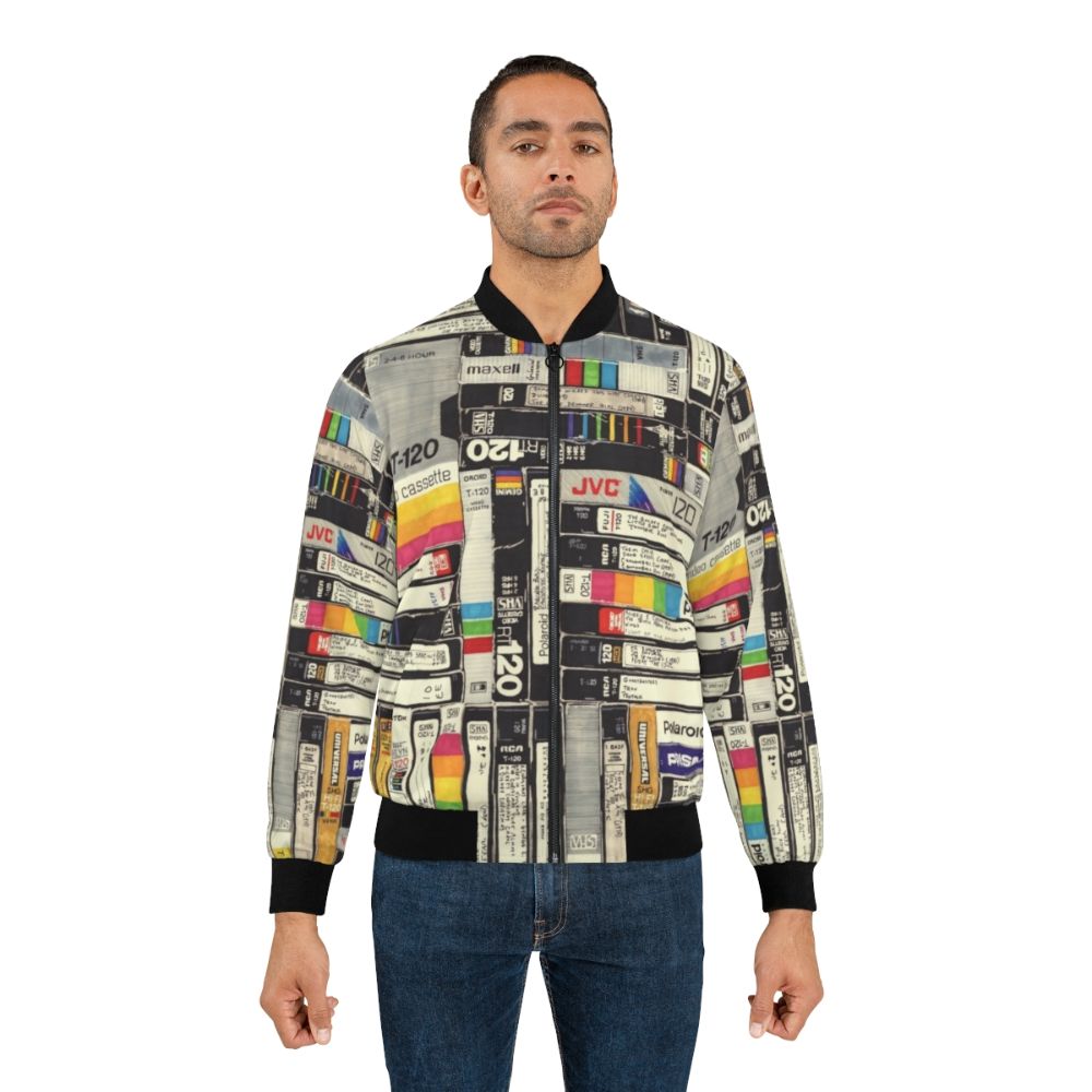 Colorful bomber jacket with VHS, permanent marker, and retro pop culture inspired graphics and patterns - Lifestyle