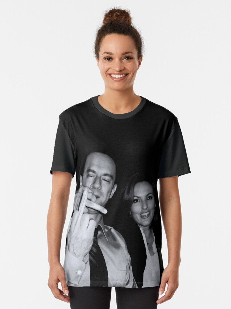 Graphic t-shirt design featuring the actors who play Elliot Stabler and Olivia Benson from the TV series "Law & Order: Special Victims Unit" making a defiant gesture. - Women