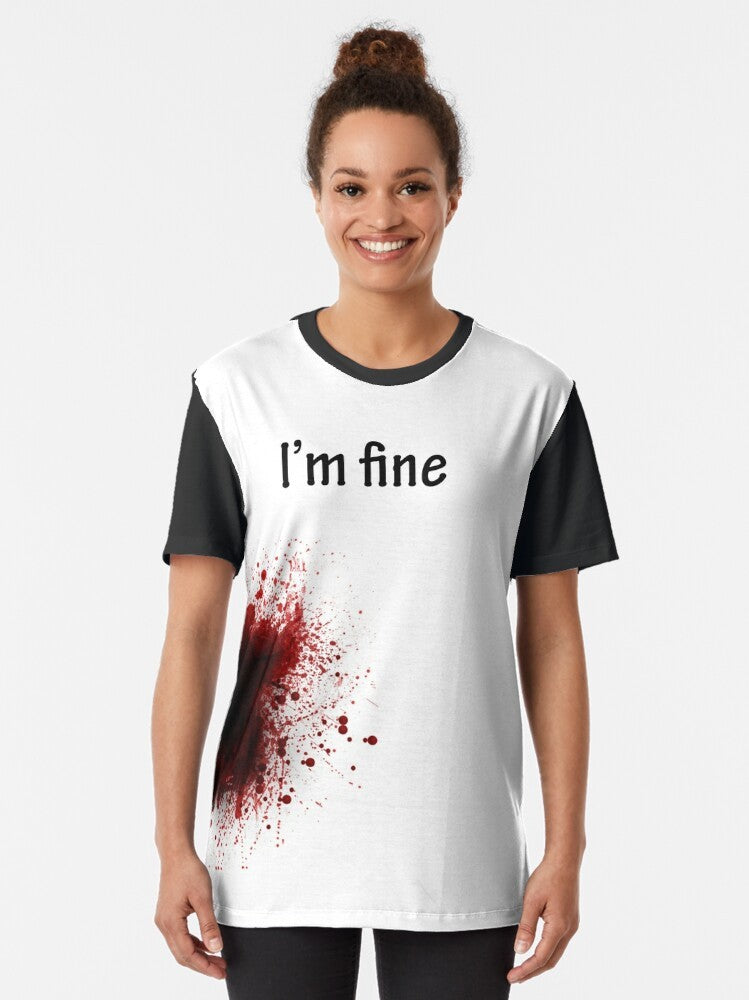 "I Am Fine" graphic t-shirt with a playful, imaginative design featuring a shooter, blood, and the text "I Am Fine" - Women