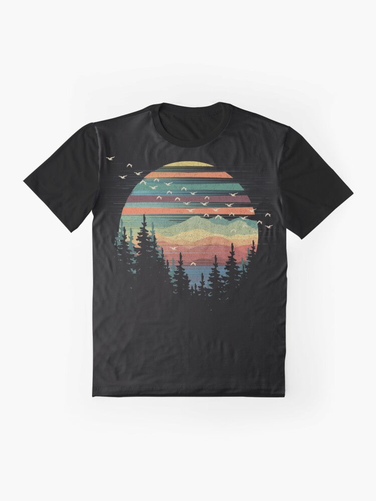 A graphic t-shirt featuring a geometric nature sunset vibes design with elements like forests, mountains, birds, and the sky. - Flat lay