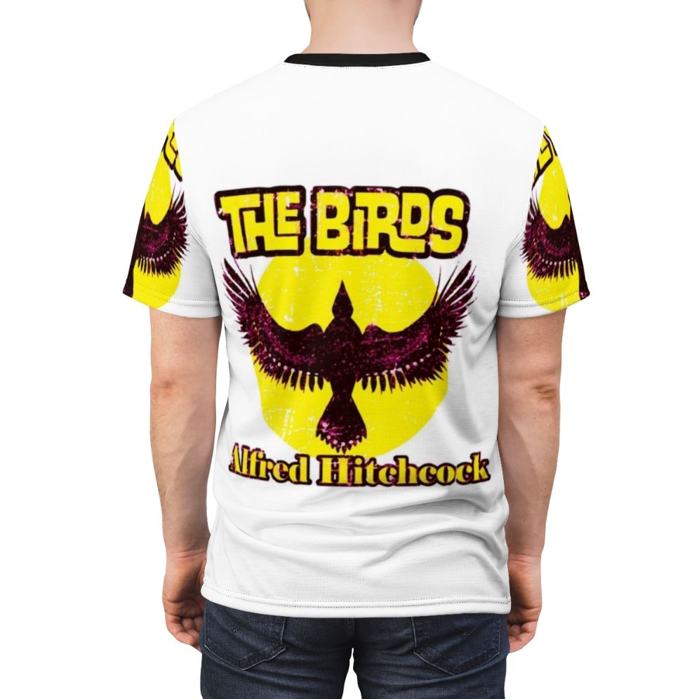 Classic T-shirt design featuring an illustration of Alfred Hitchcock, the iconic horror movie director, and a reference to his classic film "The Birds". - men back