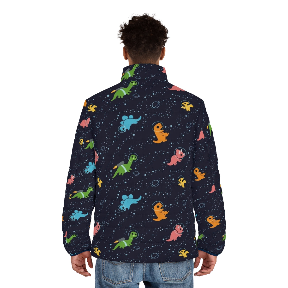 A puffer jacket featuring a whimsical pattern of dinosaurs floating in a galaxy of stars and planets. - men back