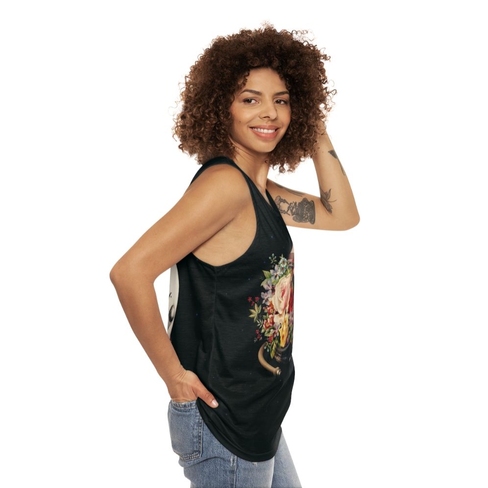 An astronaut in a space suit surrounded by flowers and stars on a cosmic, surreal tank top - women side