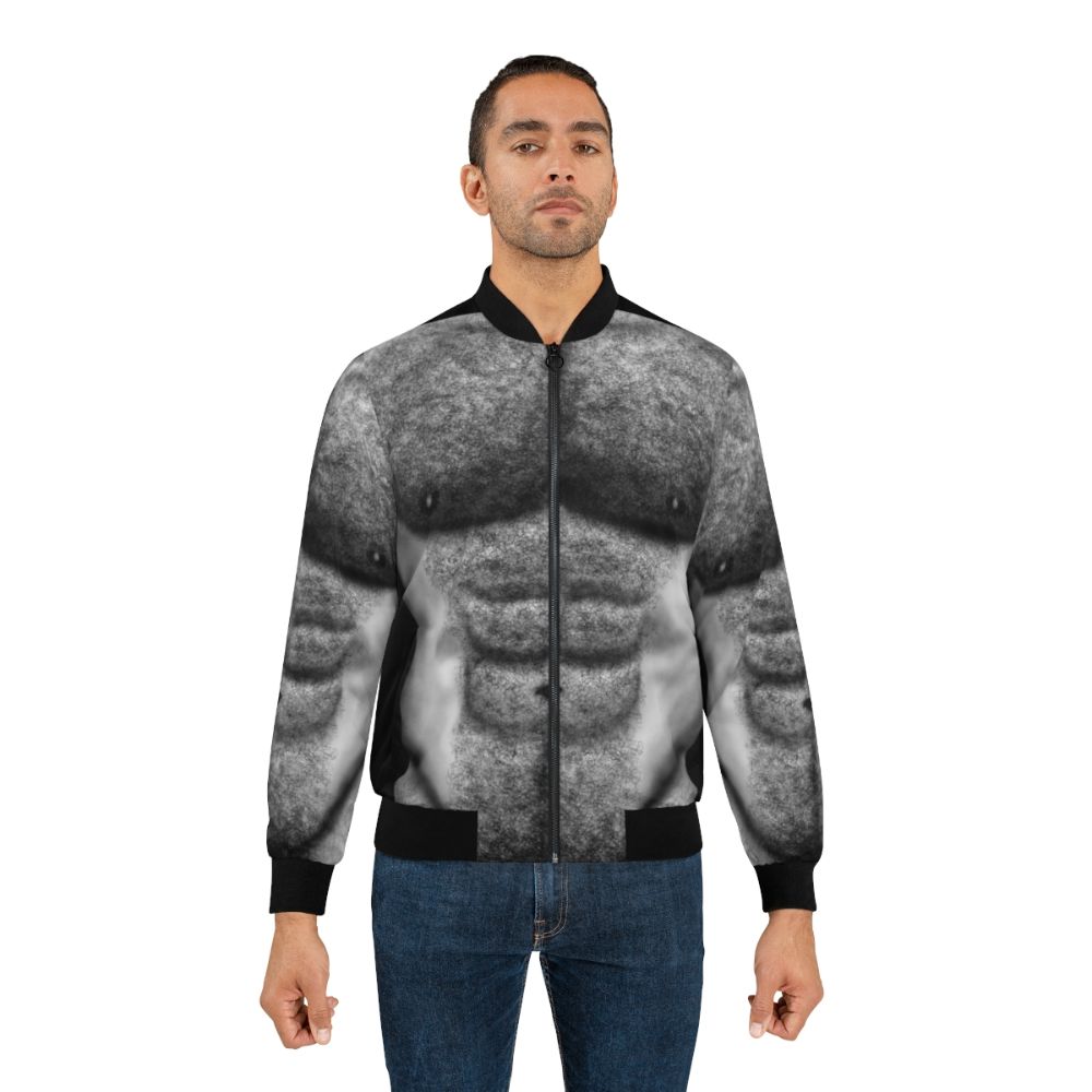 Bomber jacket featuring the hairy torso of a naked, muscular male figure in black and white. - Lifestyle