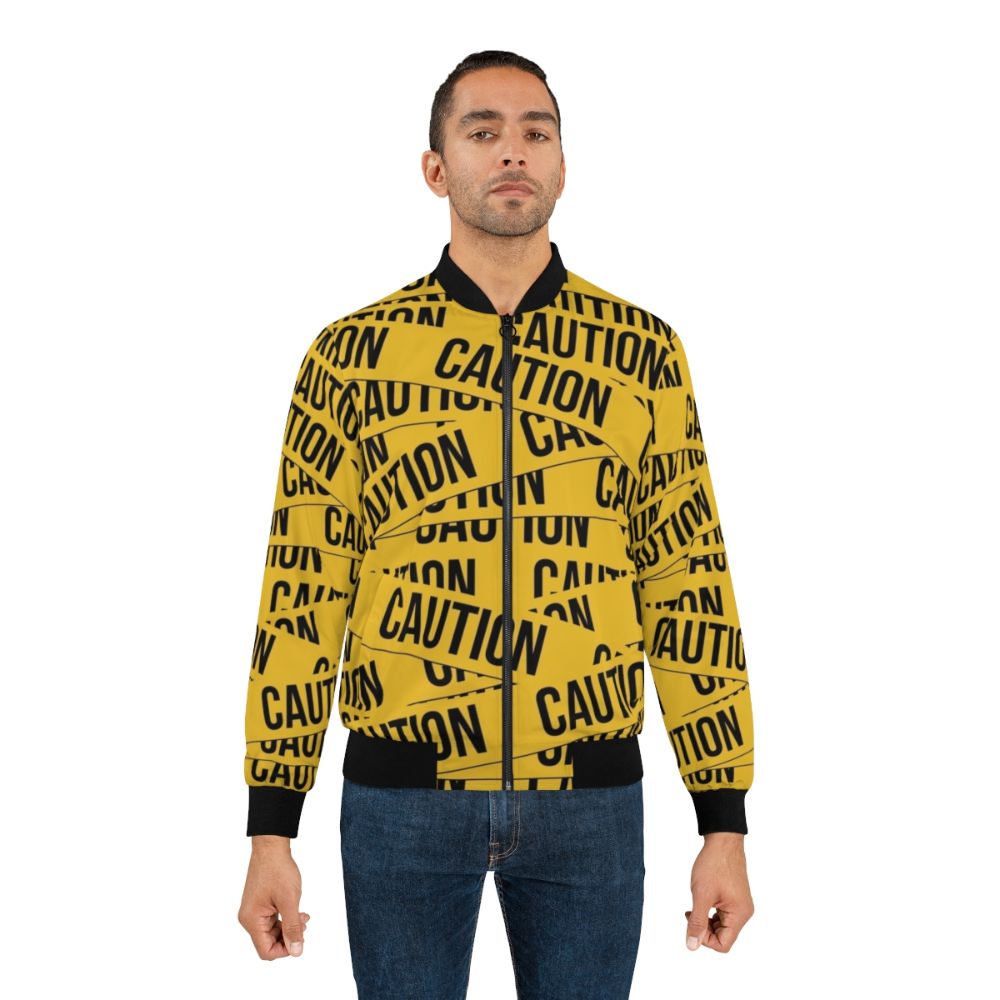 Caution bomber jacket with police tape design and warning graphics - Lifestyle