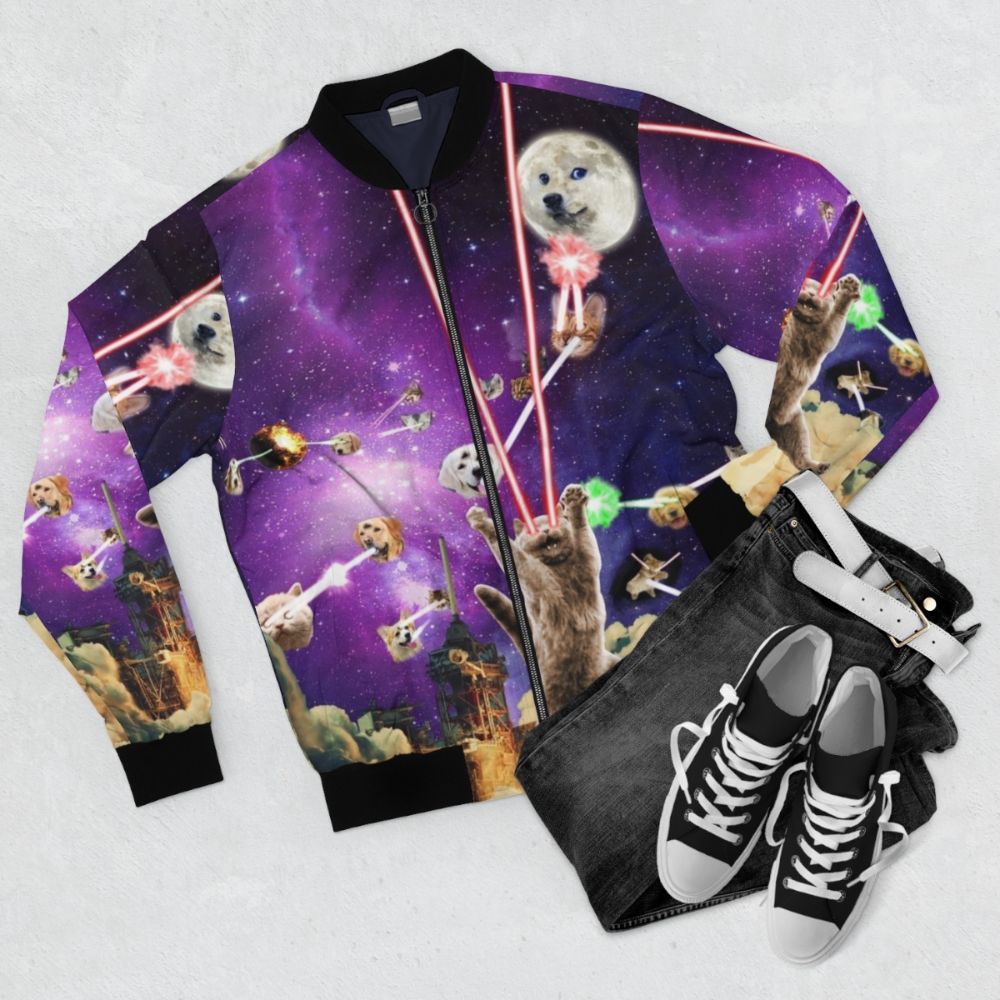 A bomber jacket featuring cats with laser eyes in a space-themed design - Flat lay